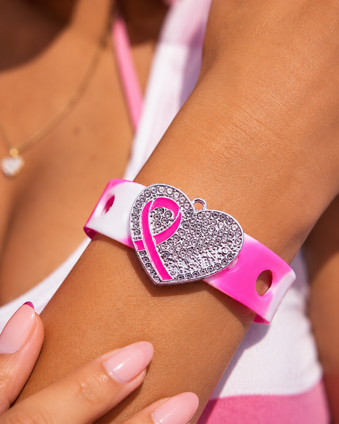š Stylish awareness bracelet featuring a sparkling rhinestone heart charm and pink ribbon design on an adjustable silicone band. Inspiring, meaningful, and elegant.