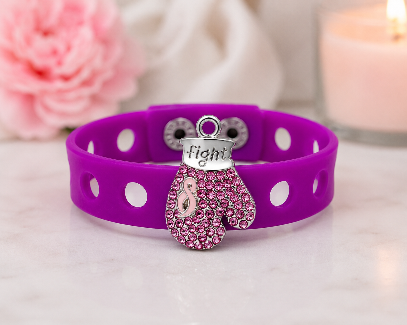 💖 Bold awareness bracelet featuring a sparkling pink rhinestone boxing glove charm and vibrant adjustable silicone band. Stylish, inspiring, and made to empower.