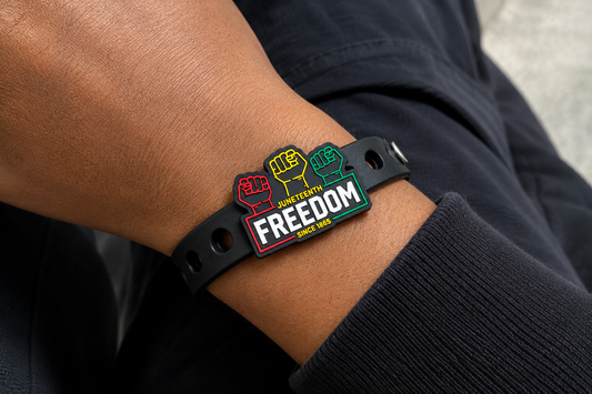 🖤 Bold Juneteenth-inspired bracelet featuring raised fist symbols and “Freedom Since 1865” on a sleek black silicone band celebrating heritage, unity, and Black excellence.