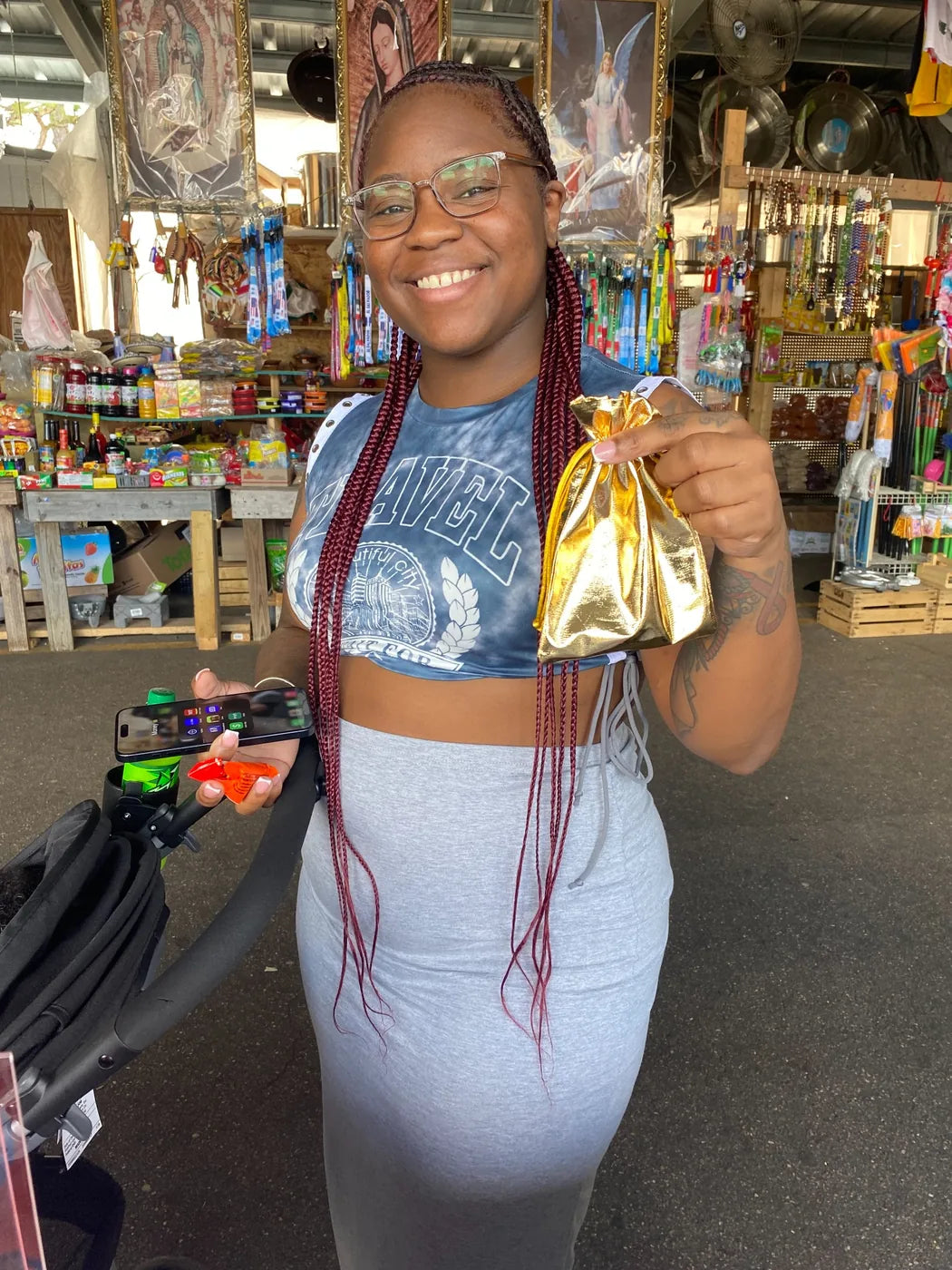Customer smiling with gold gift bag after purchase