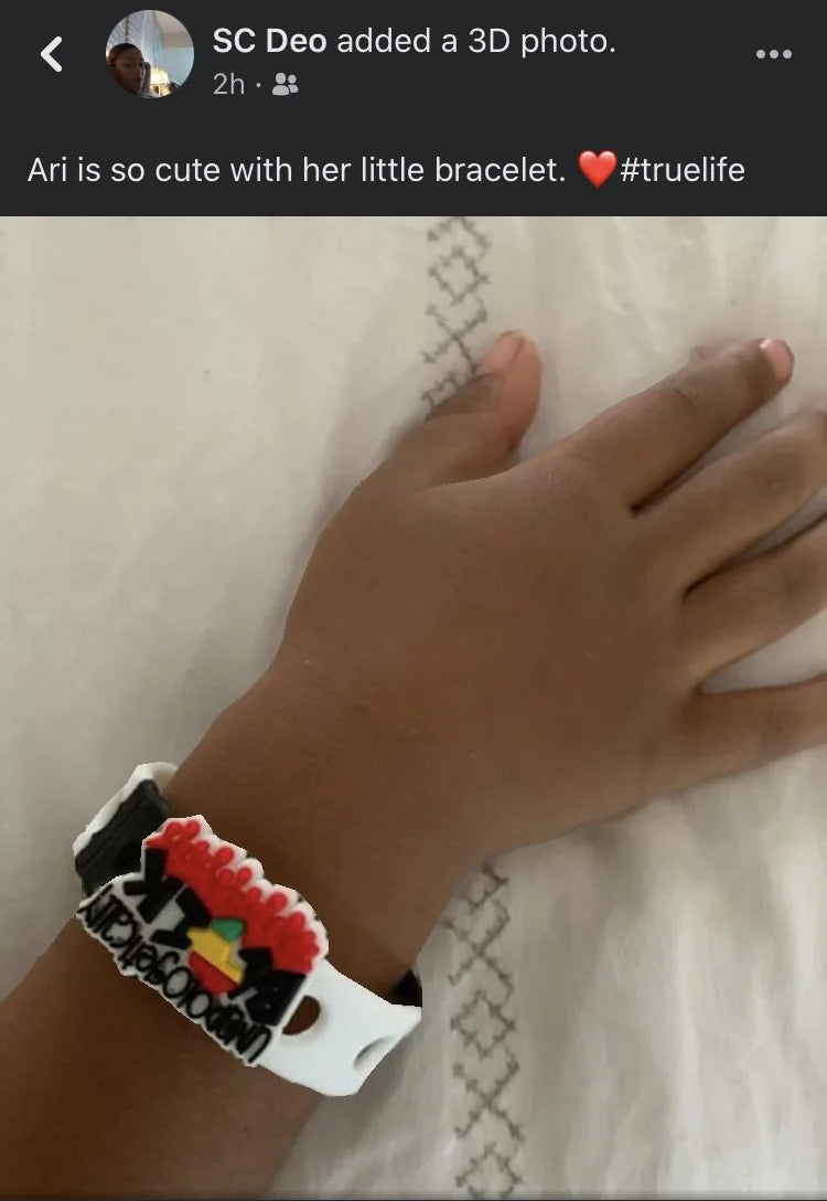 Social proof photo of child wearing True Life bracelet